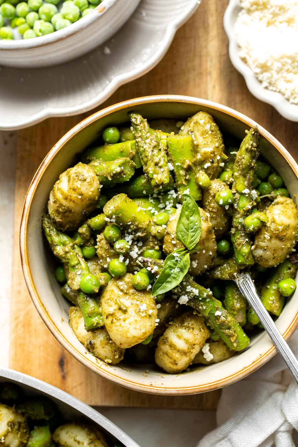 Spring Vegetable Gnocchi with tender asparagus, peas, and pesto is the perfect way to enjoy the flavors of the season. Ready in 20 minutes! | aheadofthyme.com