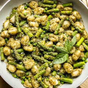 Spring Vegetable Gnocchi with tender asparagus, peas, and pesto is the perfect way to enjoy the flavors of the season. Ready in 20 minutes! | aheadofthyme.com