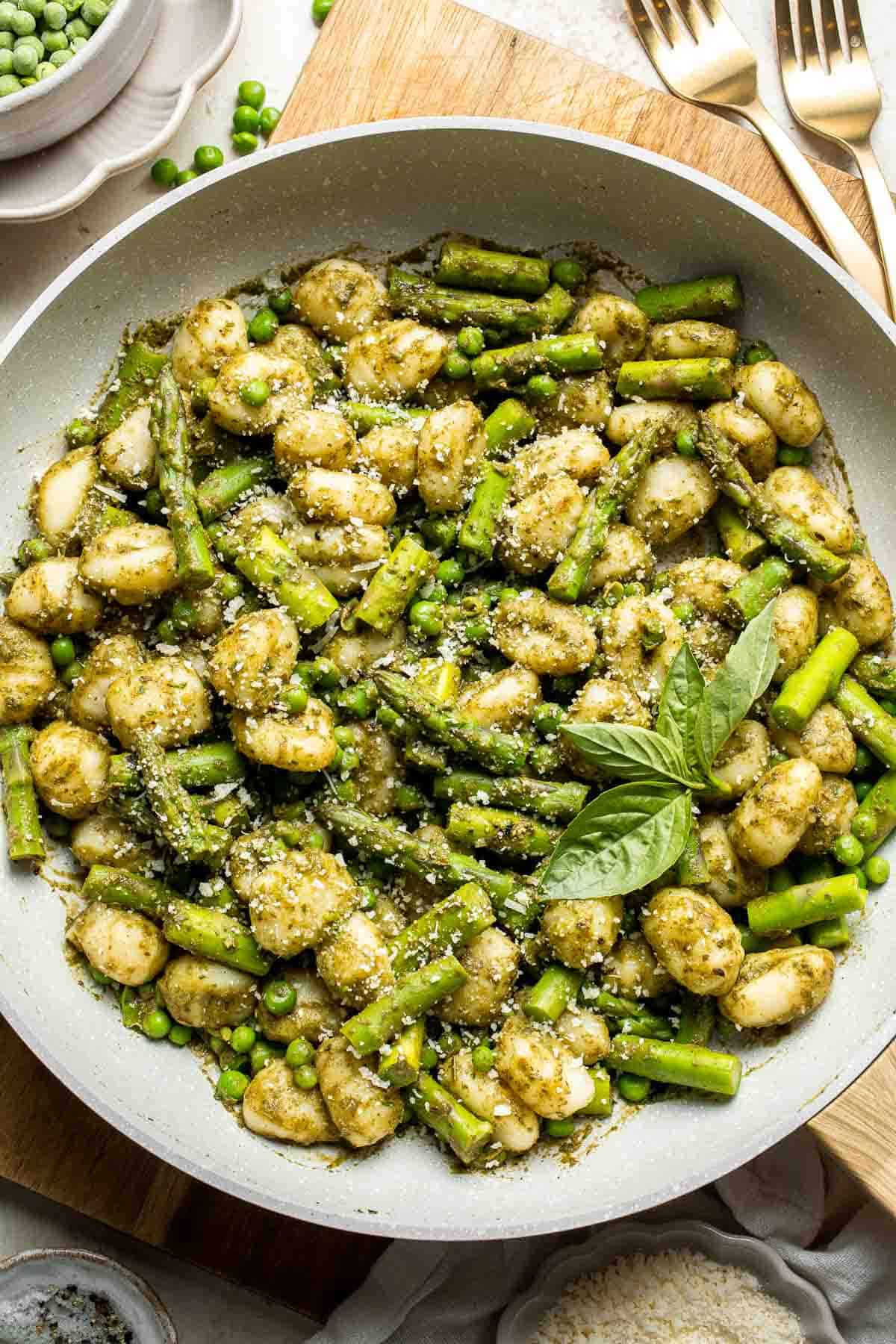 Spring Vegetable Gnocchi with tender asparagus, peas, and pesto is the perfect way to enjoy the flavors of the season. Ready in 20 minutes! | aheadofthyme.com