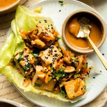 Tofu Lettuce Wraps are filled with a vegan filling of tofu, veggies, and homemade peanut sauce for the best balance of textures and flavors. | aheadofthyme.com