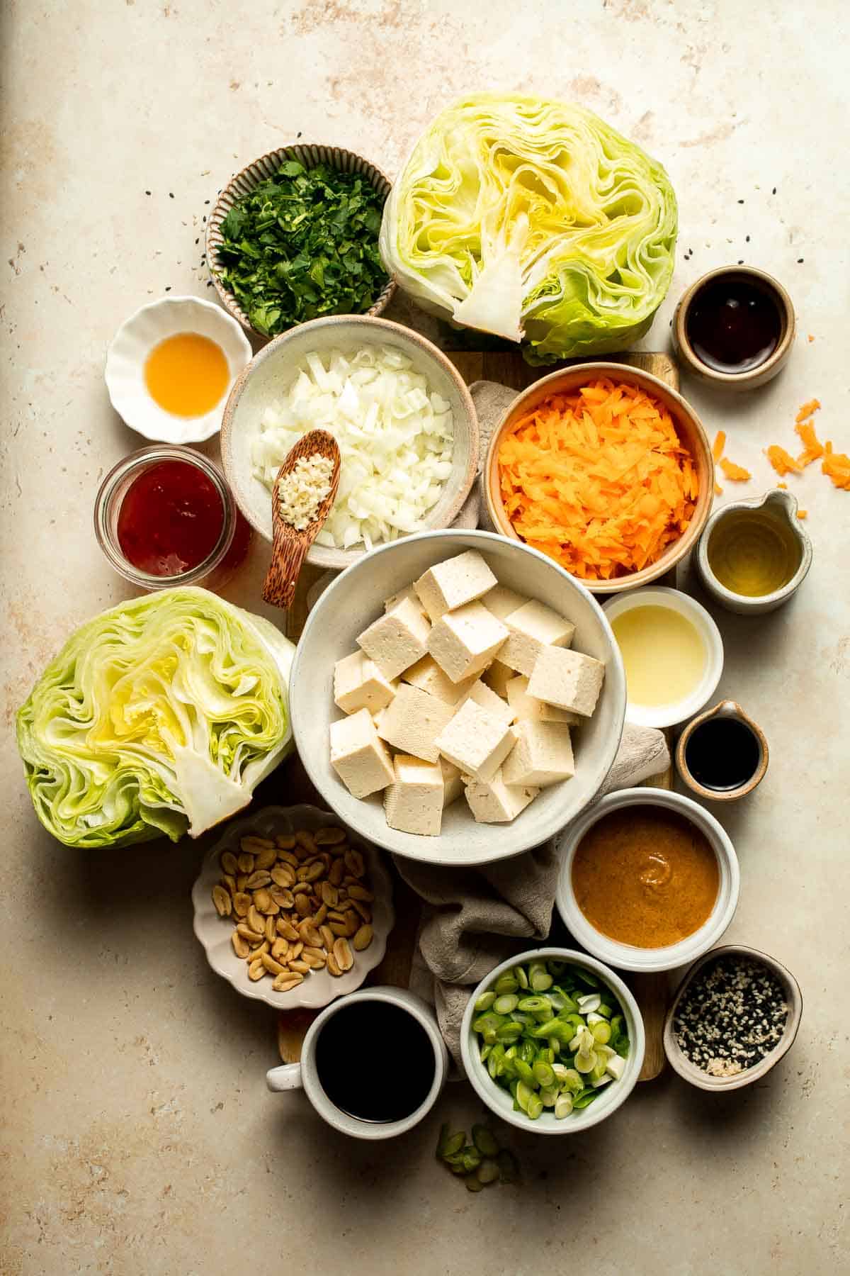 Tofu Lettuce Wraps are filled with a vegan filling of tofu, veggies, and homemade peanut sauce for the best balance of textures and flavors. | aheadofthyme.com