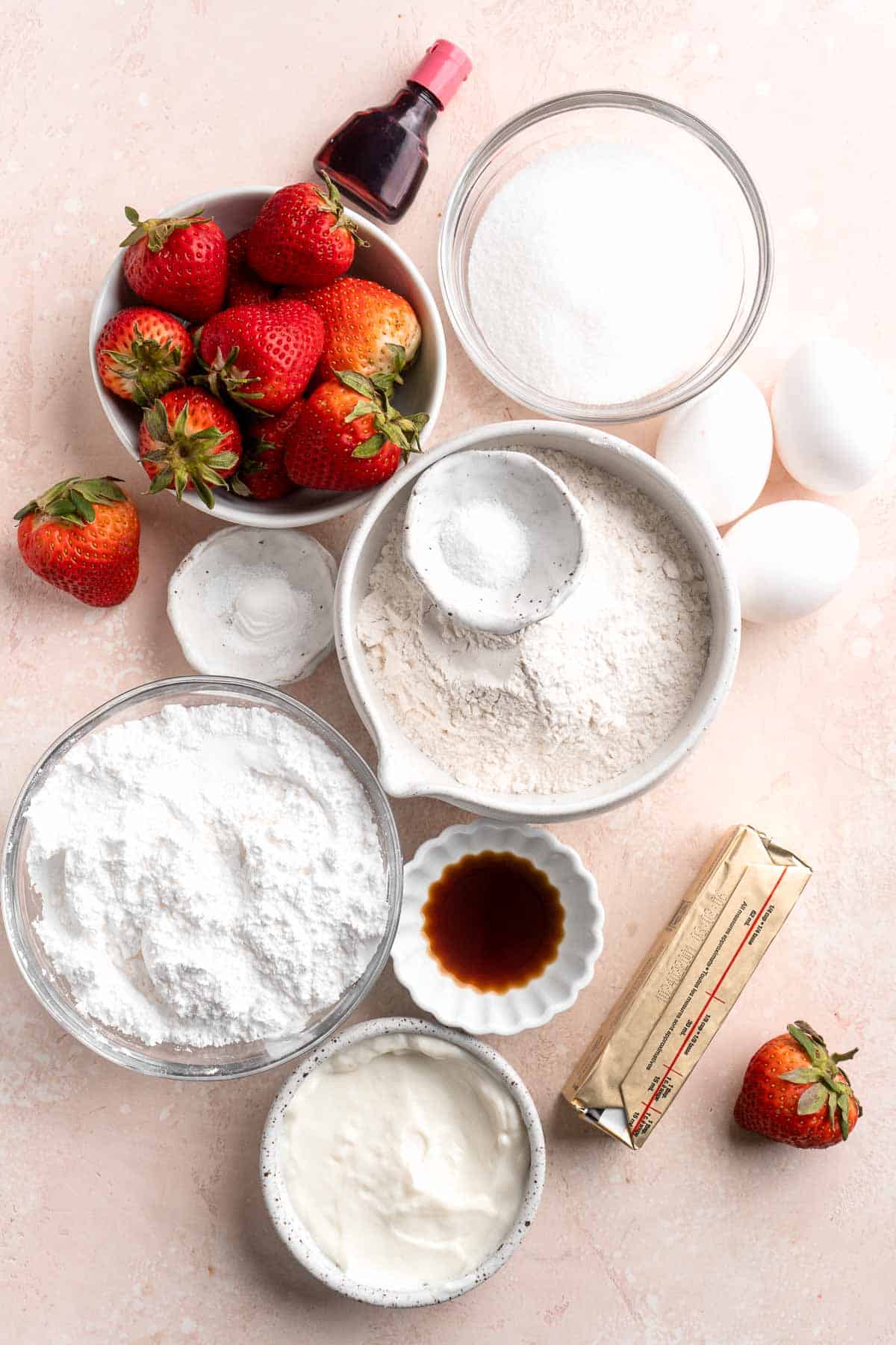 Strawberry Cupcakes are made with real strawberries in both the tender cake batter and the creamy strawberry buttercream frosting. A picture-perfect treat! | aheadofthyme.com