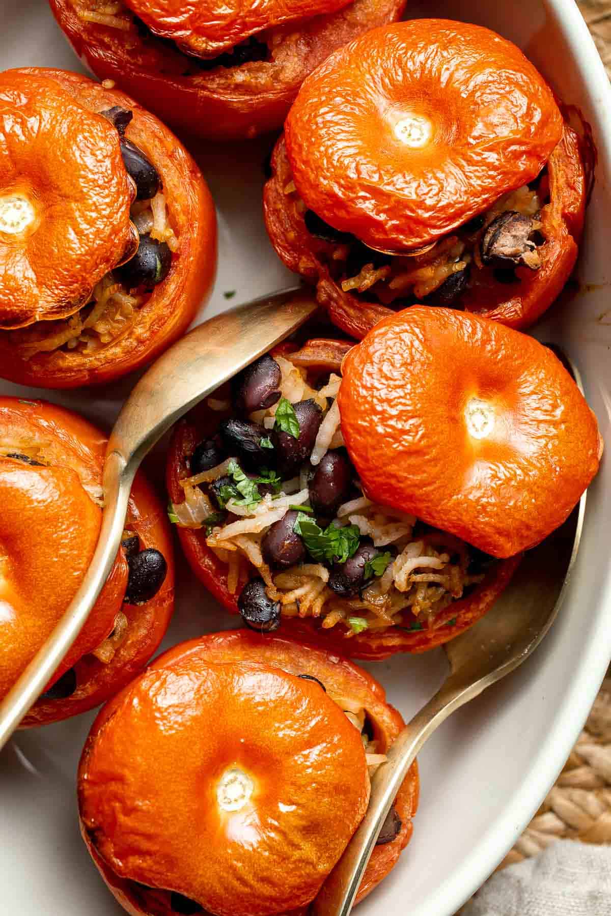 Stuffed Tomatoes are a simple vegetarian meal made with fresh tomatoes stuffed with a comforting mixture of beans and rice, and baked to perfection. | aheadofthyme.com