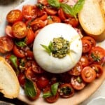 Tomato Burrata Salad is made with ultra creamy burrata over a bed of marinated tomatoes and onions and a drizzle of fresh basil pesto on top. So fresh! | aheadofthyme.com