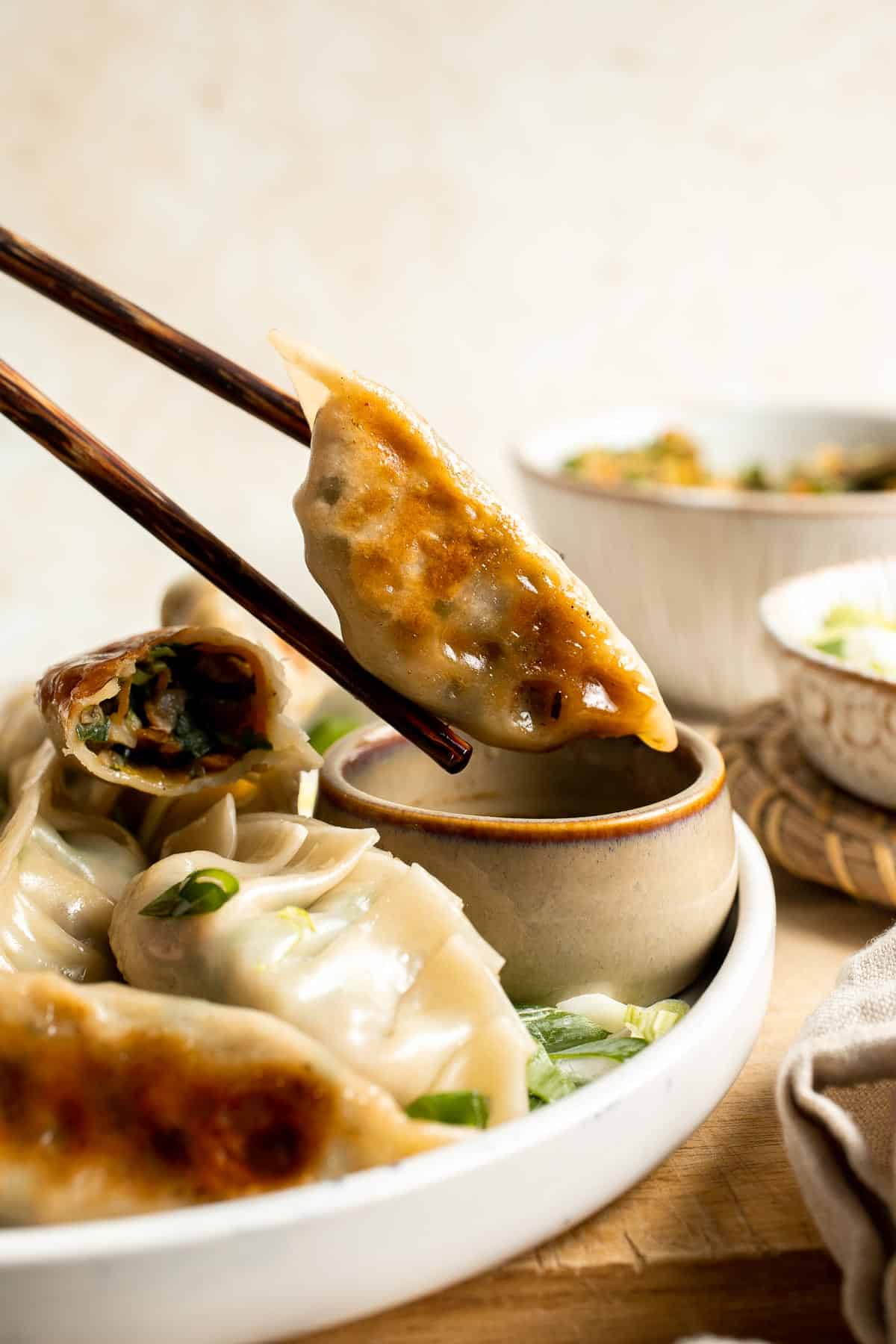 Made with a savory vegan mixture of mushrooms, cabbage, carrots, and more, these homemade Vegetable Dumplings are meaty and satisfying — without any meat! | aheadofthyme.com