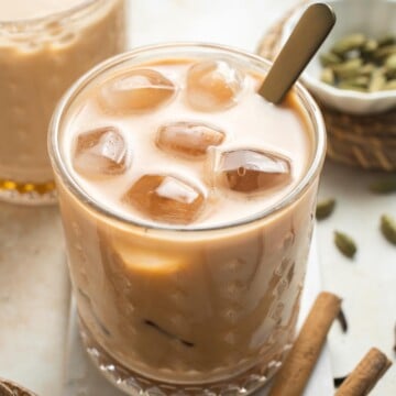 Sweet, spicy, and ice cold, is there anything more refreshing than an Iced Chai Latte? It's easy to make at home with just a teabag and a little patience. | aheadofthyme.com