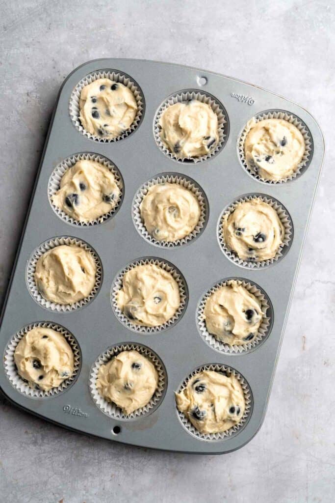 Blueberry Cupcakes are a homemade treat with moist and tender vanilla cupcake batter loaded with fresh blueberries and topped with blueberry buttercream. | aheadofthyme.com
