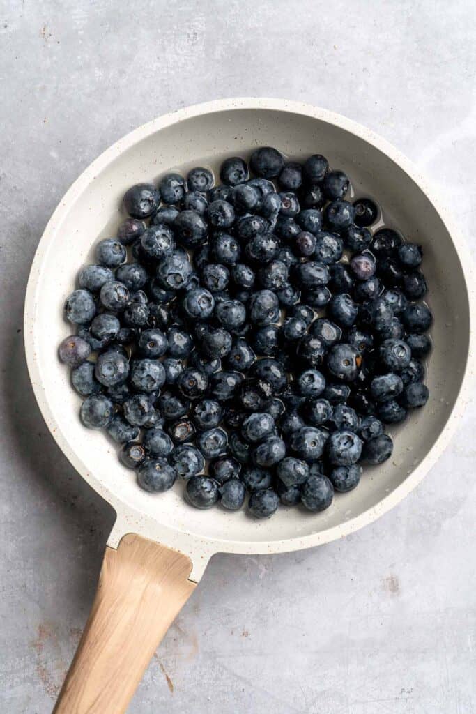 Blueberry Cupcakes are a homemade treat with moist and tender vanilla cupcake batter loaded with fresh blueberries and topped with blueberry buttercream. | aheadofthyme.com