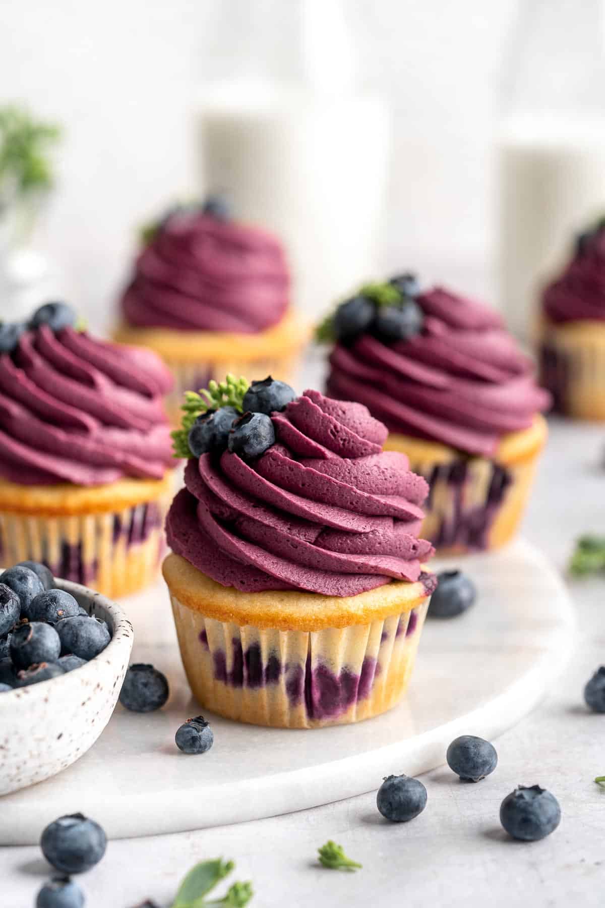 Blueberry Cupcakes are a homemade treat with moist and tender vanilla cupcake batter loaded with fresh blueberries and topped with blueberry buttercream. | aheadofthyme.com