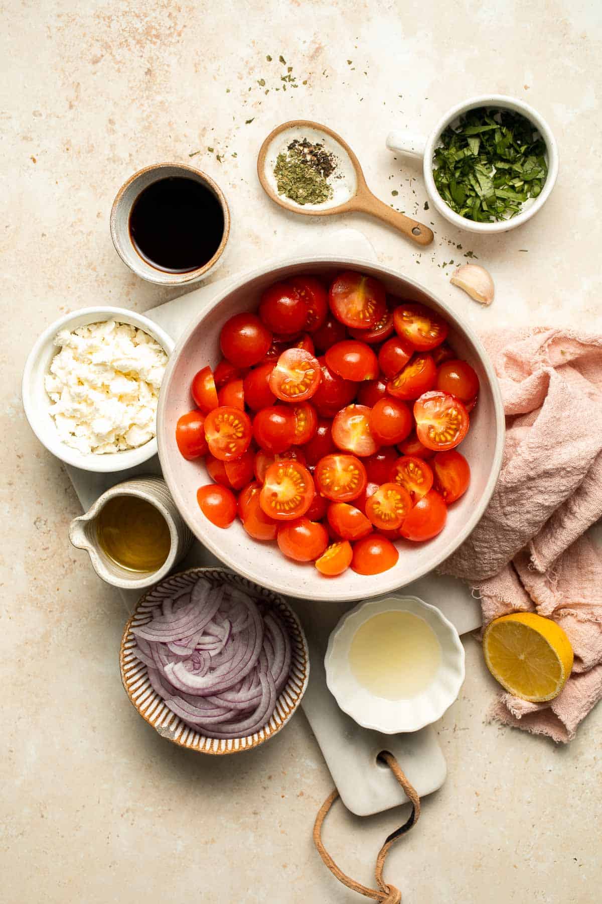This quick and easy Cherry Tomato Salad is made with sweet cherry tomatoes, red onion, fresh basil, and feta cheese tossed in a simple vinaigrette. | aheadofthyme.com