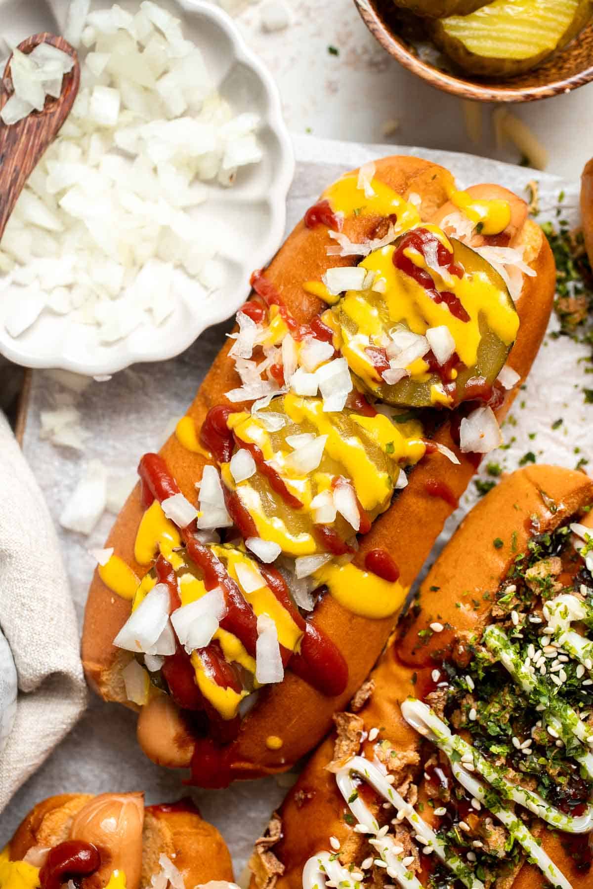 Juicy and delicious Gourmet Hot Dogs loaded with a variety of toppings will take your next backyard BBQ or potluck to a whole new level. Try them all! | aheadofthyme.com