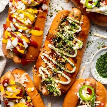 Juicy and delicious Gourmet Hot Dogs loaded with a variety of toppings will take your next backyard BBQ or potluck to a whole new level. Try them all! | aheadofthyme.com