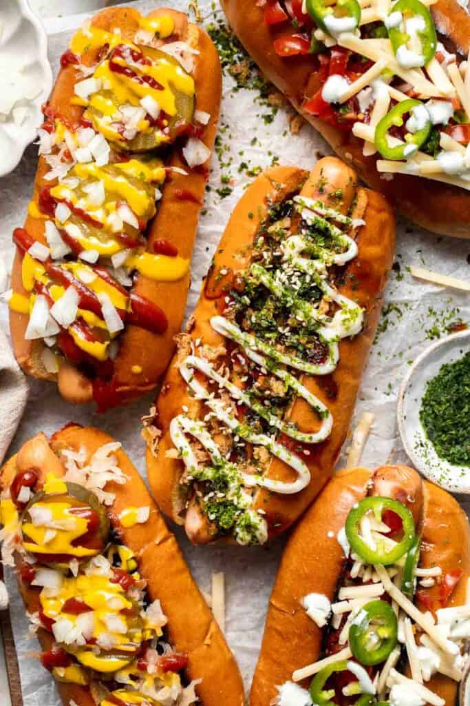 Juicy and delicious Gourmet Hot Dogs loaded with a variety of toppings will take your next backyard BBQ or potluck to a whole new level. Try them all! | aheadofthyme.com