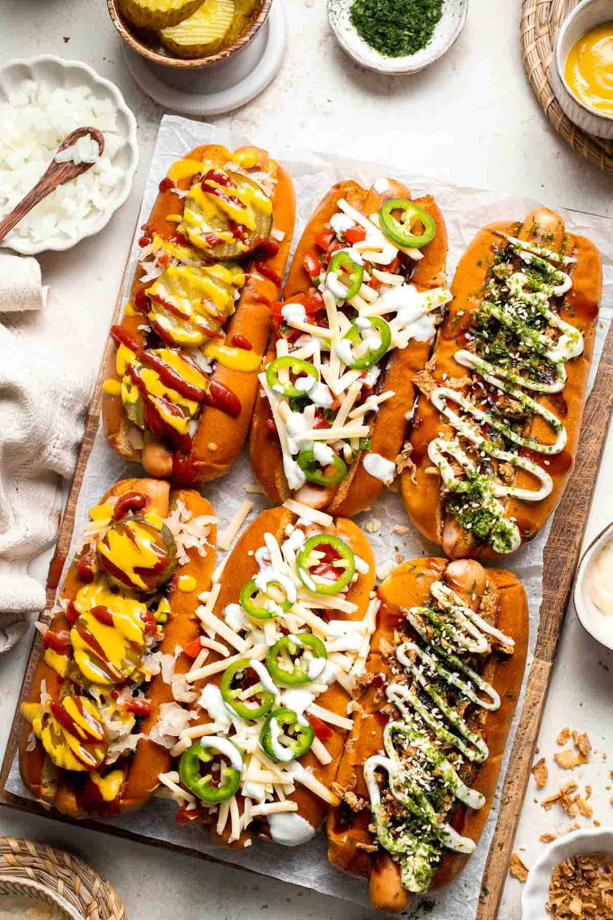 Juicy and delicious Gourmet Hot Dogs loaded with a variety of toppings will take your next backyard BBQ or potluck to a whole new level. Try them all! | aheadofthyme.com