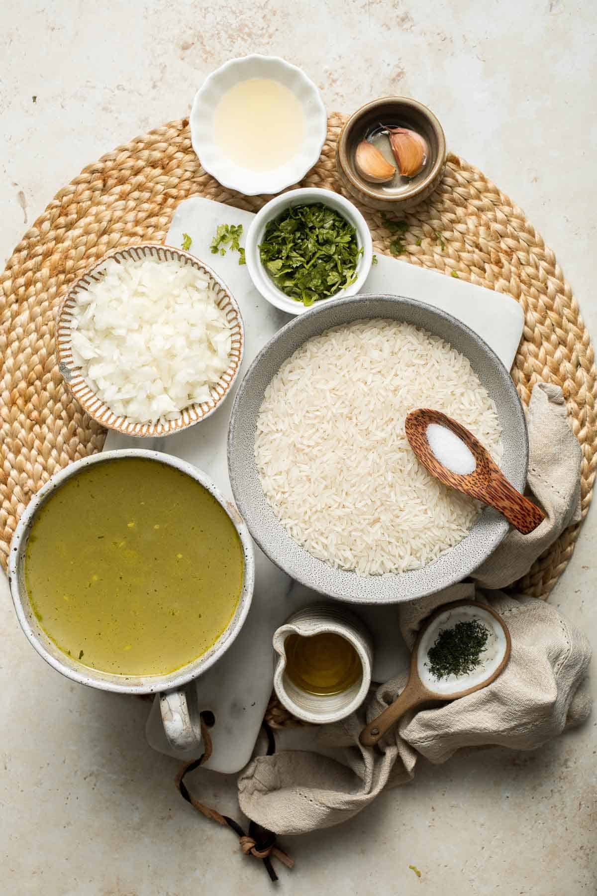 This simple Greek Rice is lemony, full of herbs, and warm, delicious flavors — and it couldn't be much easier to make. Our go-to fluffy herb rice dish! | aheadofthyme.com