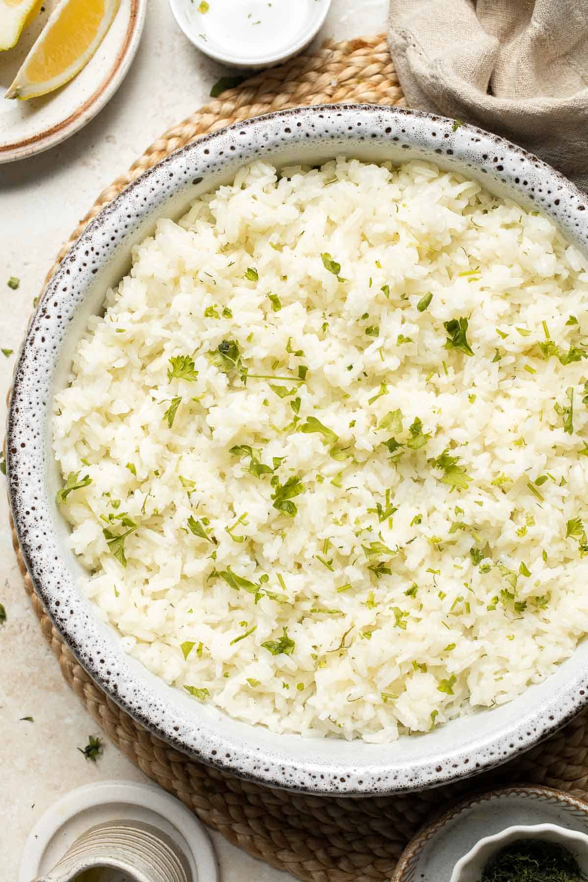 This simple Greek Rice is lemony, full of herbs, and warm, delicious flavors — and it couldn't be much easier to make. Our go-to fluffy herb rice dish! | aheadofthyme.com
