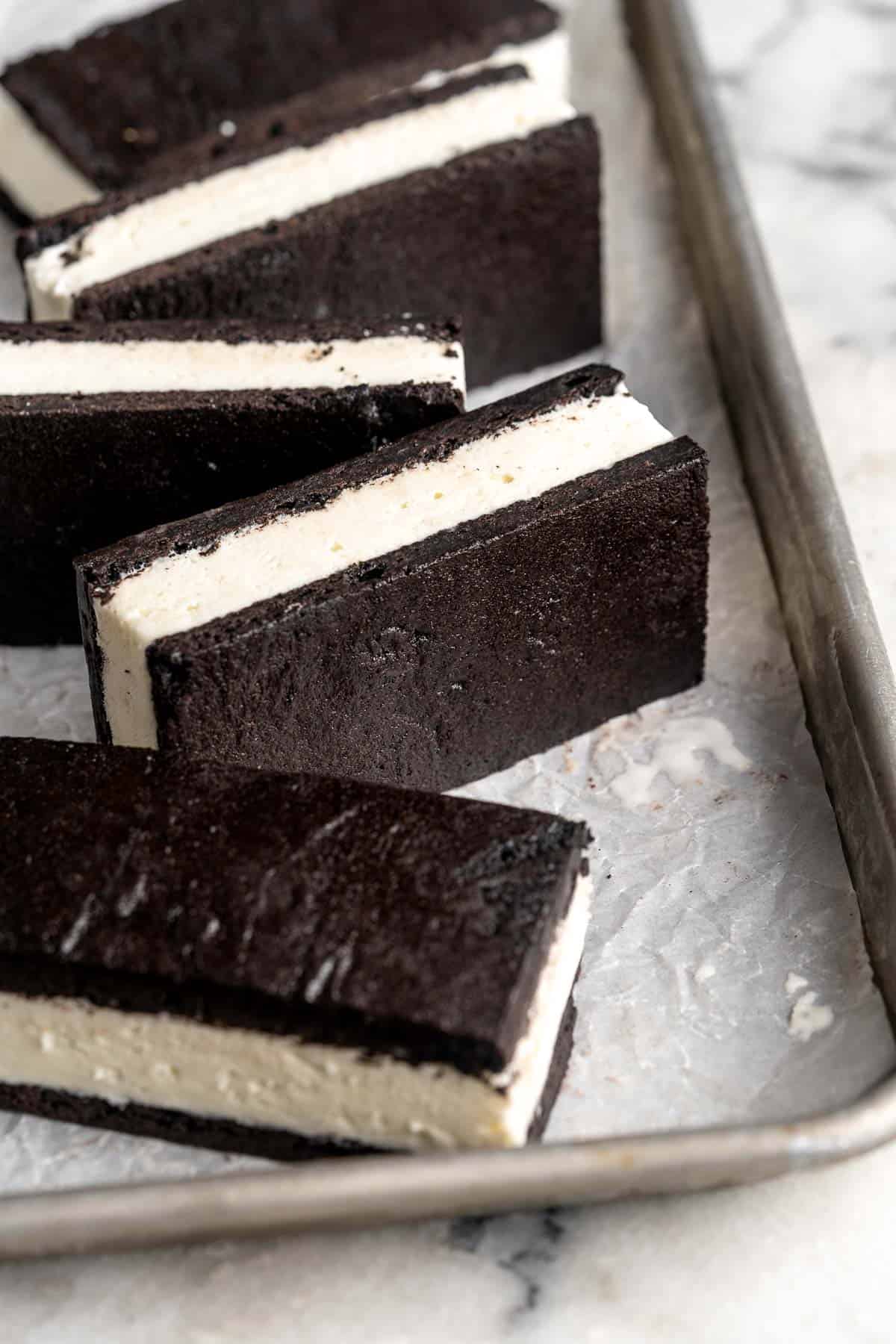 Homemade Ice Cream Sandwiches are made with creamy vanilla ice cream perfectly nestled between two tender homemade chocolate cookies. | aheadofthyme.com