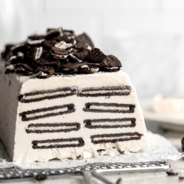 This old-fashioned Icebox Cake is no bake dessert made with creamy homemade vanilla whipped cream, layered with crunchy, chocolaty Oreo cookies, and frozen. | aheadofthyme.com