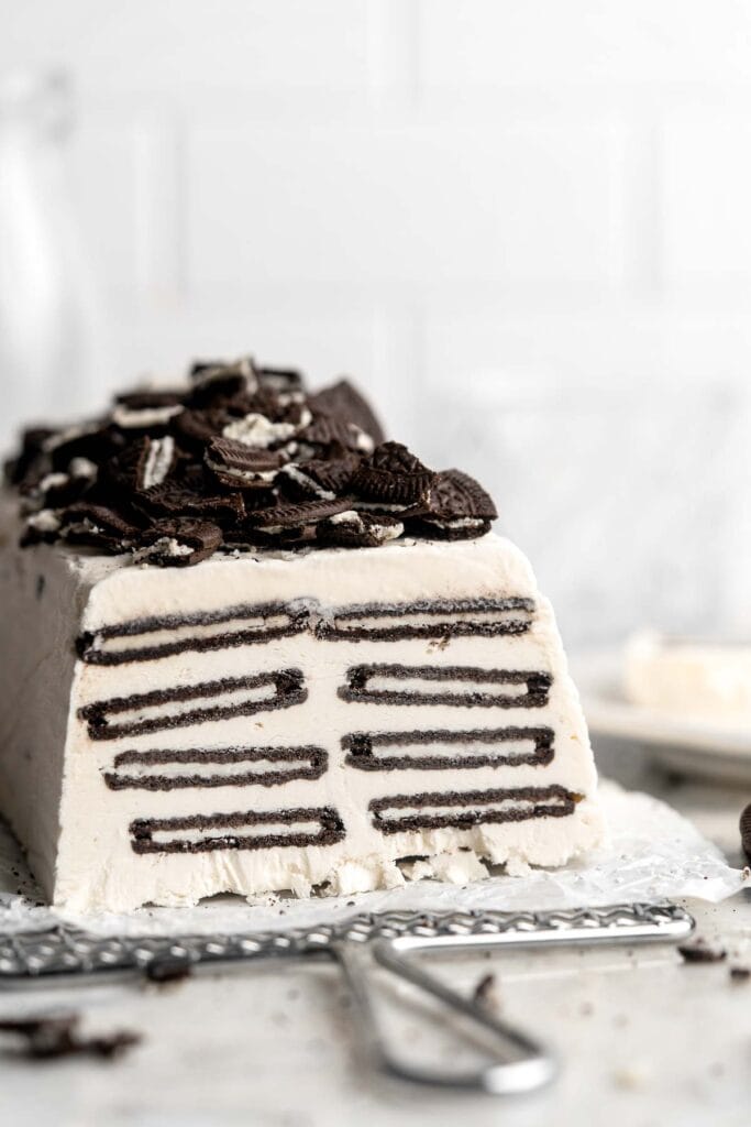 This old-fashioned Icebox Cake is no bake dessert made with creamy homemade vanilla whipped cream, layered with crunchy, chocolaty Oreo cookies, and frozen. | aheadofthyme.com