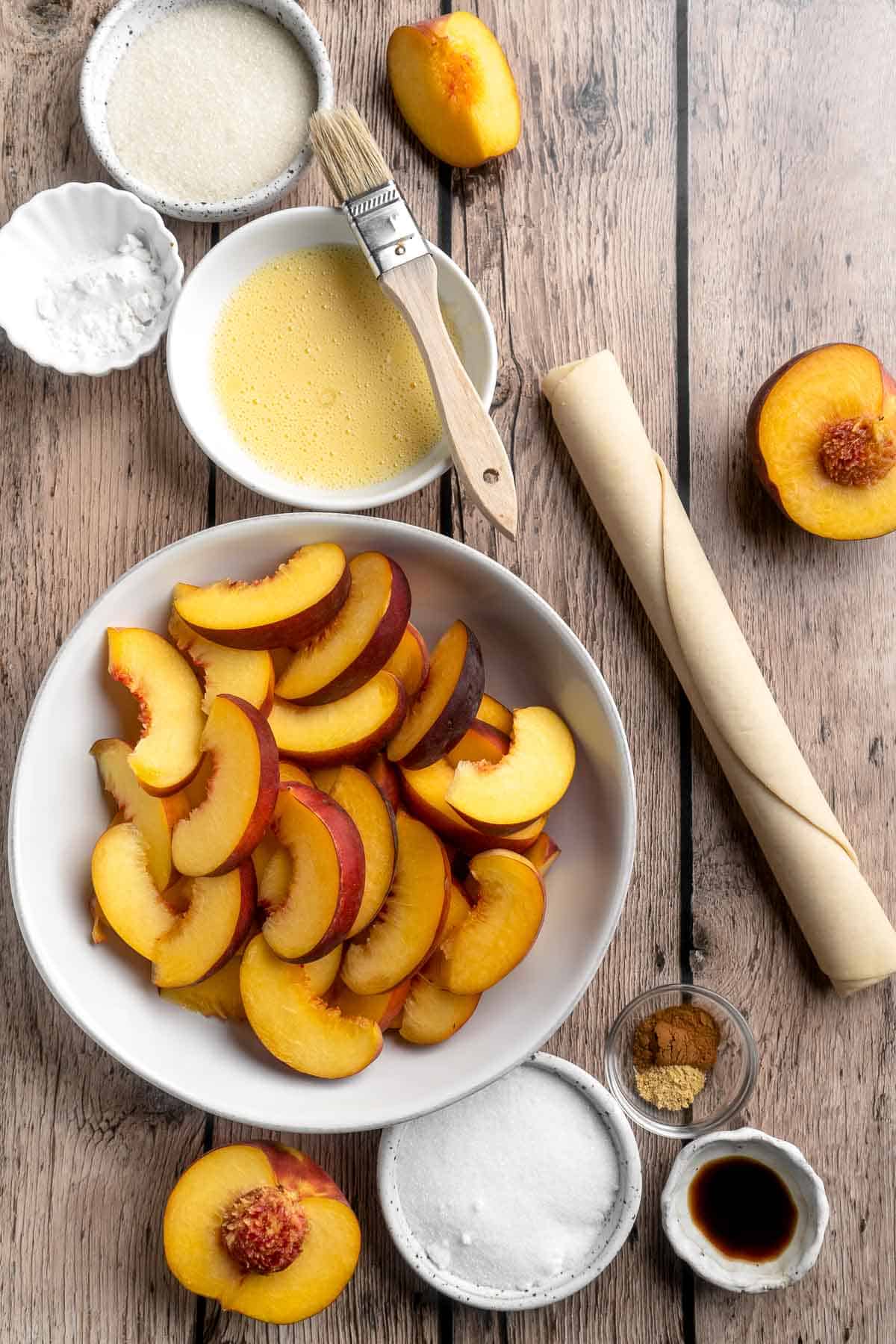 This homemade Peach Galette is a simple, rustic tart, perfect for enjoying the flavors of summer! It's buttery and flaky with tender, spiced peaches. | aheadofthyme.com