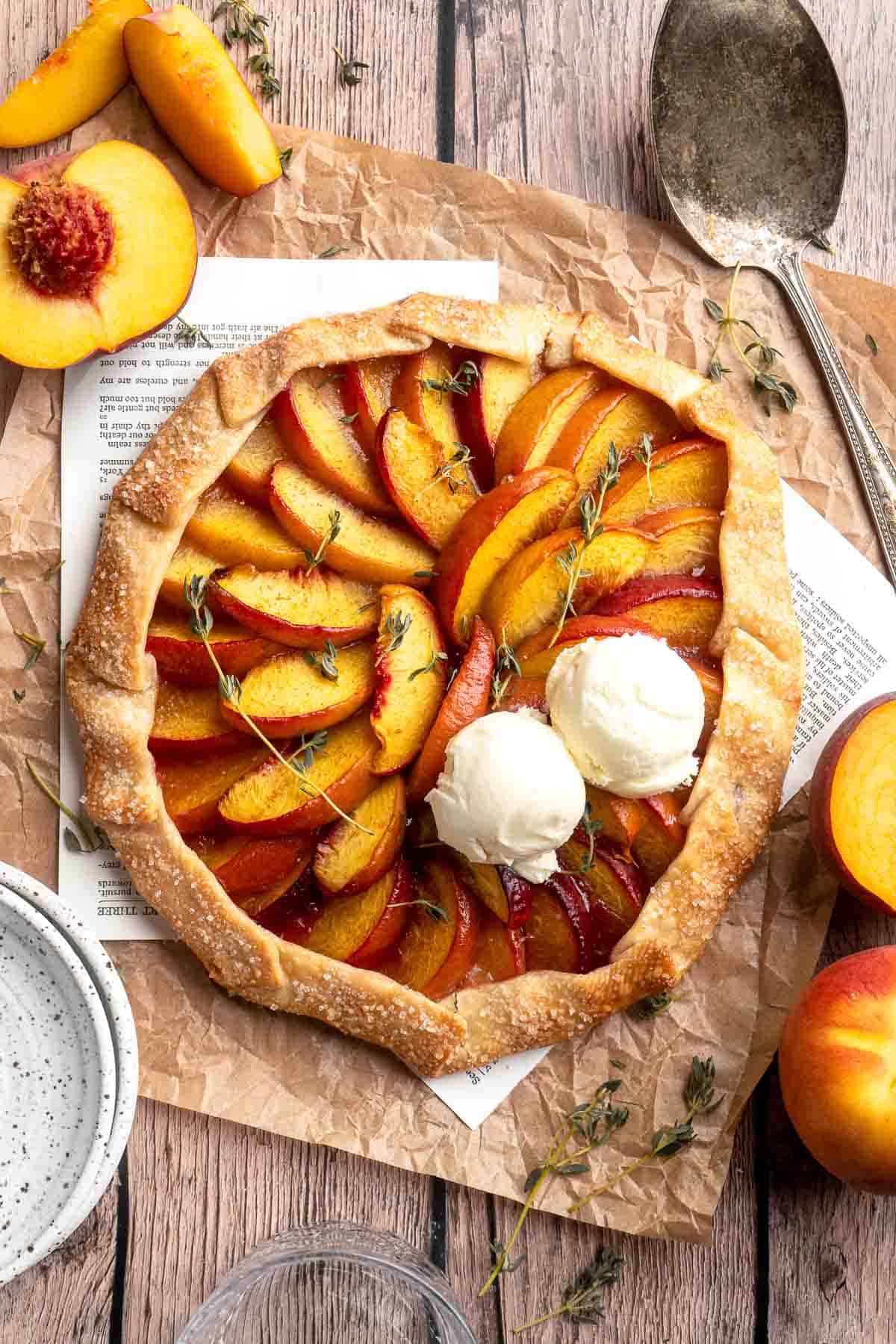 This homemade Peach Galette is a simple, rustic tart, perfect for enjoying the flavors of summer! It's buttery and flaky with tender, spiced peaches. | aheadofthyme.com