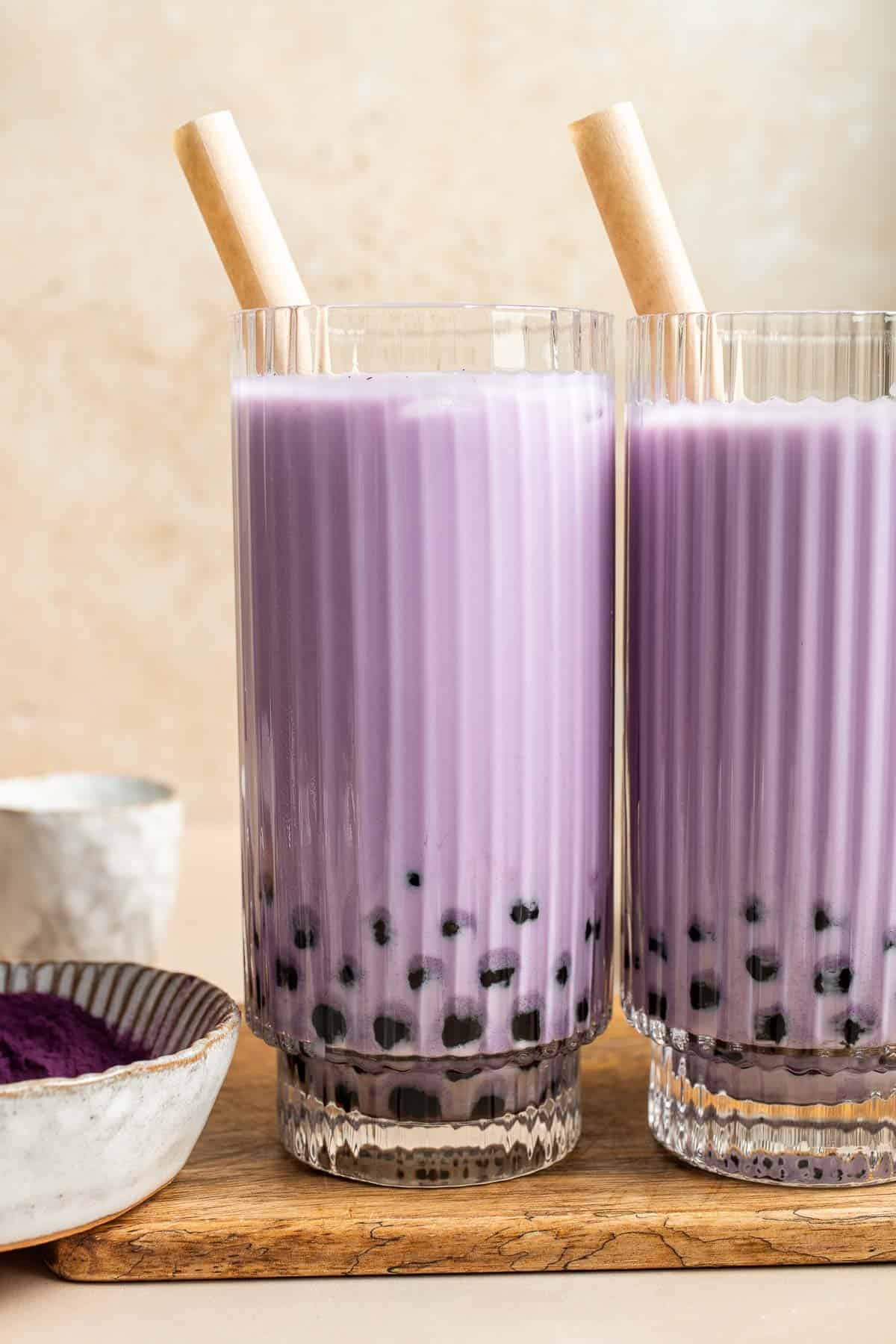 Homemade Taro Bubble Tea is cold and creamy with a nutty vanilla flavor with pops of chewy boba pearls. It's a lot easier to make at home than you think! | aheadofthyme.com