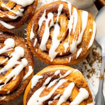 Pillowy and buttery Cinnamon Roll Muffins are a smaller version of traditional cinnamon rolls that are baked in a regular muffin pan for easy serving. | aheadofthyme.com