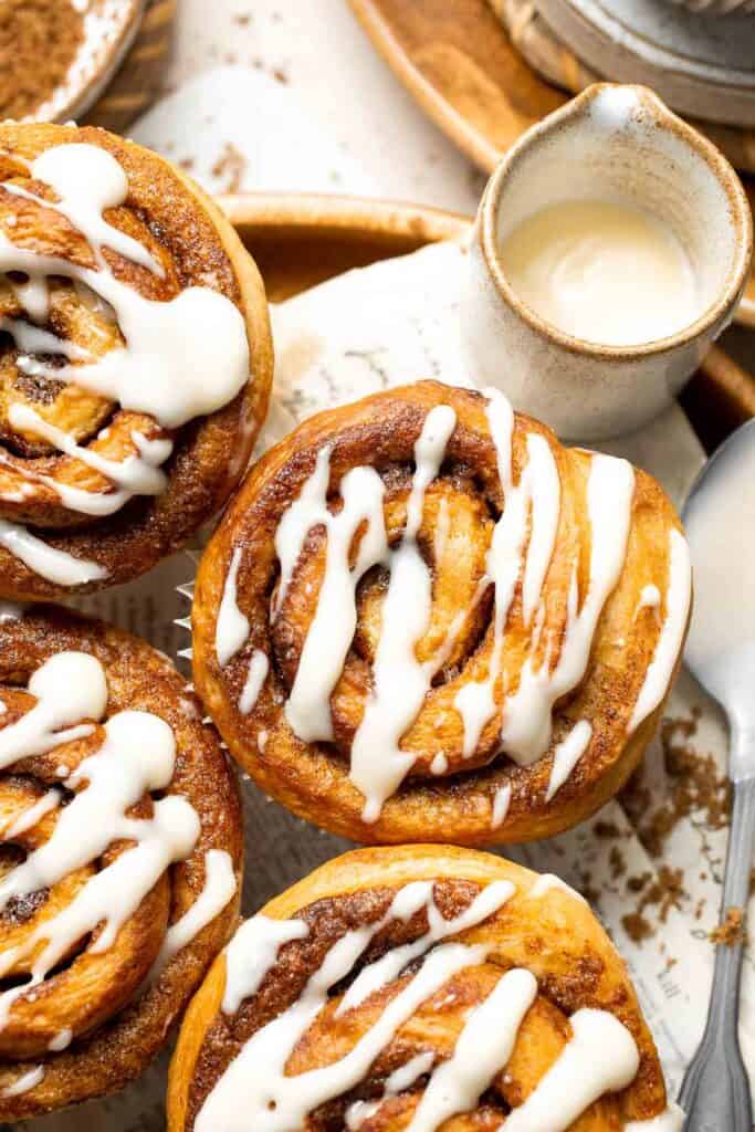 Pillowy and buttery Cinnamon Roll Muffins are a smaller version of traditional cinnamon rolls that are baked in a regular muffin pan for easy serving. | aheadofthyme.com