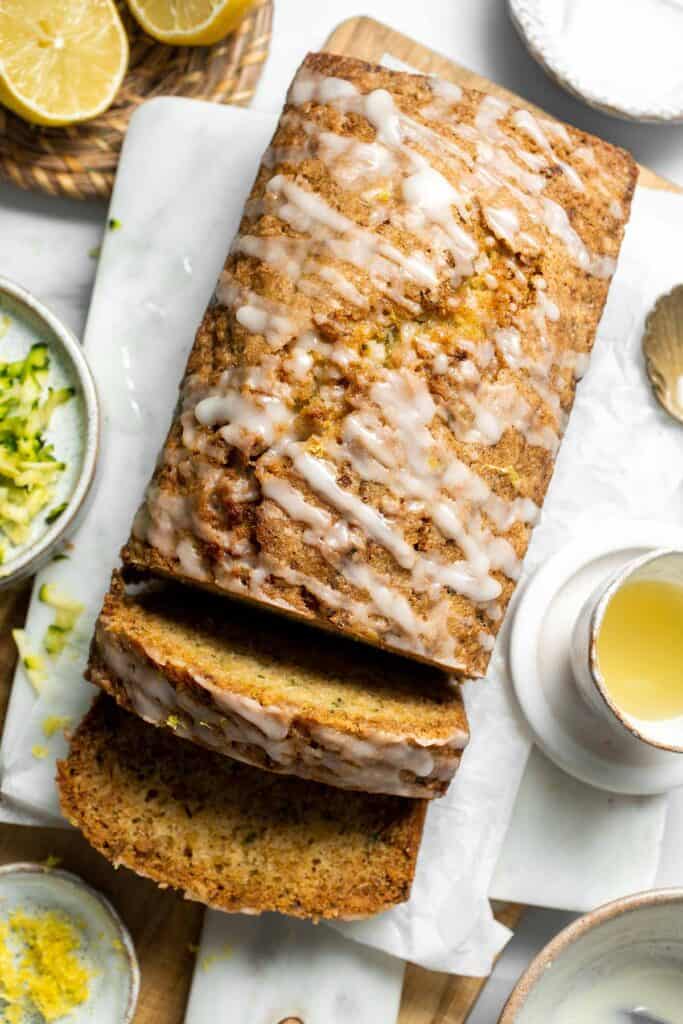 This Lemon Zucchini Bread is moist and tender, loaded with fresh zucchini with a burst of lemon, and a homemade lemon glaze on top. | aheadofthyme.com