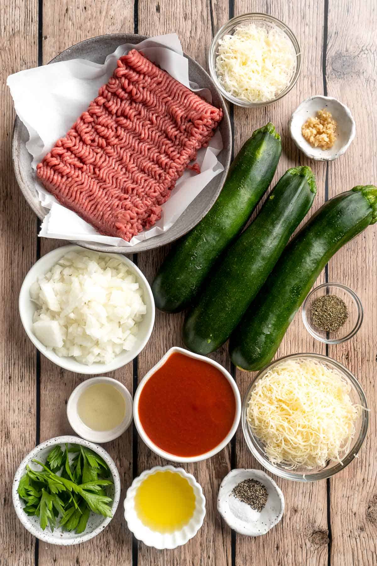 Stuffed Zucchini Boats are a fun, low carb dinner filled with a hearty meat sauce, topped with cheese, and baked until melty and bubbly. | aheadofthyme.com
