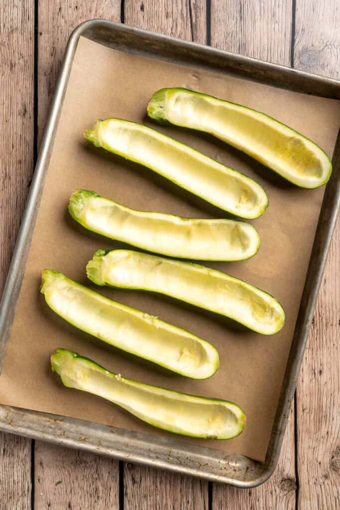Stuffed Zucchini Boats are a fun, low carb dinner filled with a hearty meat sauce, topped with cheese, and baked until melty and bubbly. | aheadofthyme.com