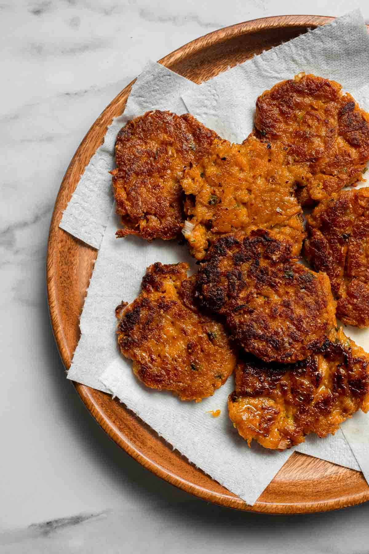 Sweet Potato Fritters are easy to make, flavorful, and delicious. They're pan-fried to perfection with a crisp crust on the outside and a soft bite inside. | aheadofthyme.com