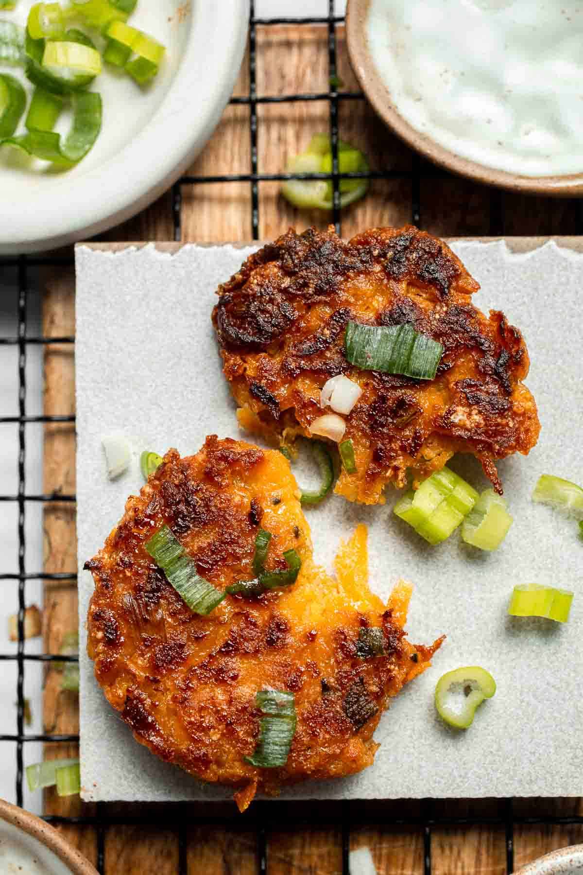 Sweet Potato Fritters are easy to make, flavorful, and delicious. They're pan-fried to perfection with a crisp crust on the outside and a soft bite inside. | aheadofthyme.com
