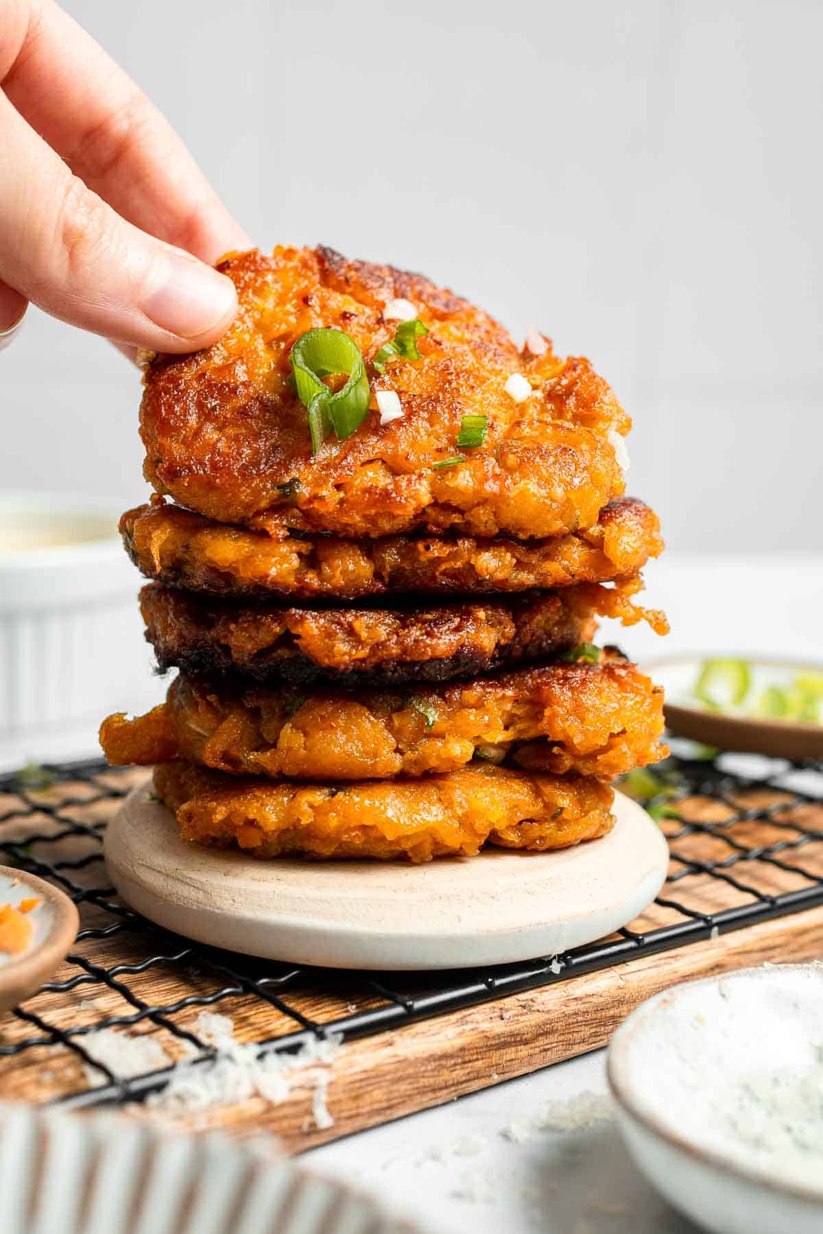 Sweet Potato Fritters are easy to make, flavorful, and delicious. They're pan-fried to perfection with a crisp crust on the outside and a soft bite inside. | aheadofthyme.com