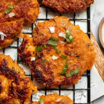 Sweet Potato Fritters are easy to make, flavorful, and delicious. They're pan-fried to perfection with a crisp crust on the outside and a soft bite inside. | aheadofthyme.com