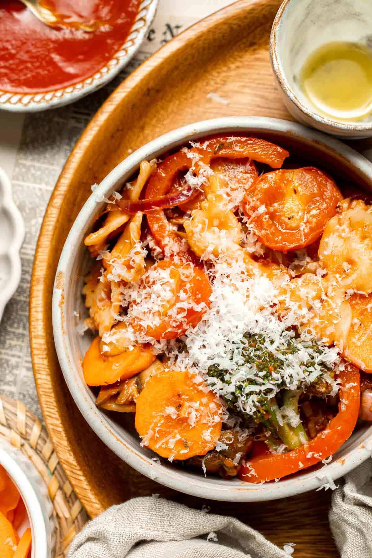 This Veggie Pasta dish combines seasonal veggies with pasta in a simple tomato sauce. Ready in 30 minutes, it's fast enough for any night of the week! | aheadofthyme.com