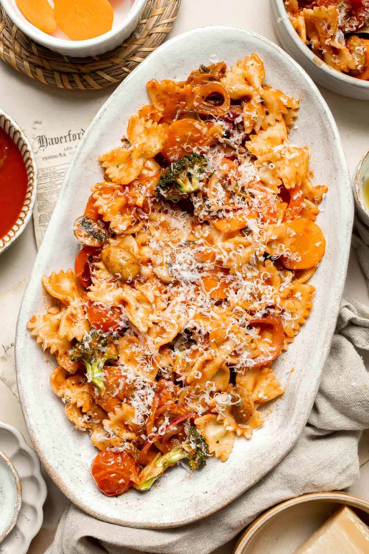 This Veggie Pasta dish combines seasonal veggies with pasta in a simple tomato sauce. Ready in 30 minutes, it's fast enough for any night of the week! | aheadofthyme.com