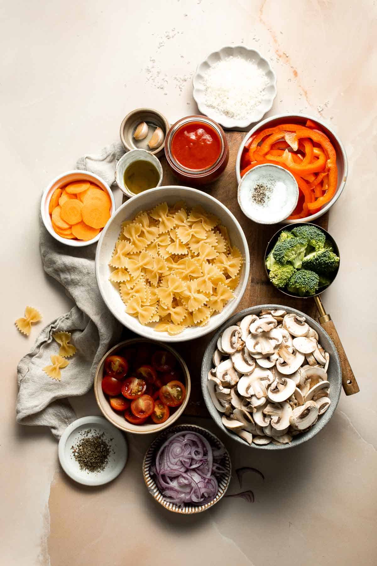 This Veggie Pasta dish combines seasonal veggies with pasta in a simple tomato sauce. Ready in 30 minutes, it's fast enough for any night of the week! | aheadofthyme.com