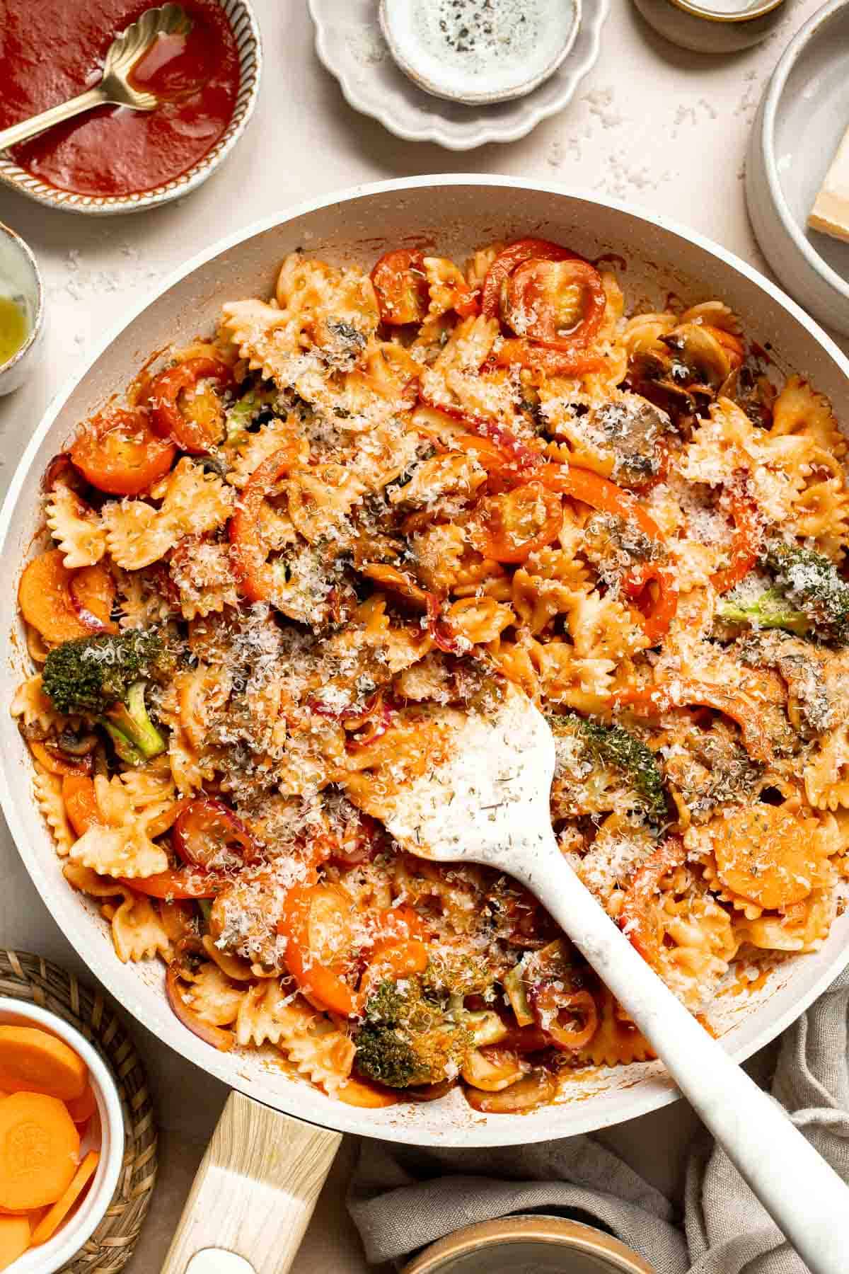This Veggie Pasta dish combines seasonal veggies with pasta in a simple tomato sauce. Ready in 30 minutes, it's fast enough for any night of the week! | aheadofthyme.com