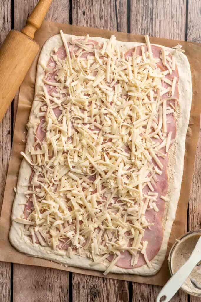 Freshly baked from the oven, these Ham and Cheese Pinwheels are warm and tender with gooey melty cheese and sweet ham. Perfect for lunch or dinner! | aheadofthyme.com