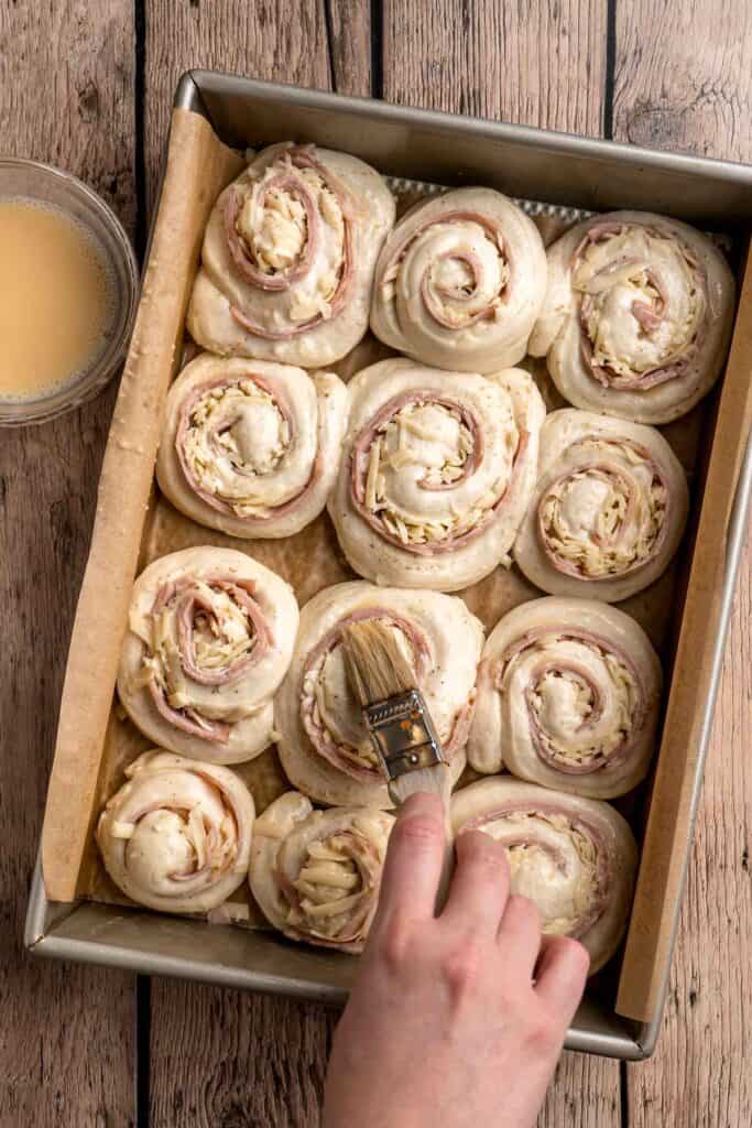 Freshly baked from the oven, these Ham and Cheese Pinwheels are warm and tender with gooey melty cheese and sweet ham. Perfect for lunch or dinner! | aheadofthyme.com