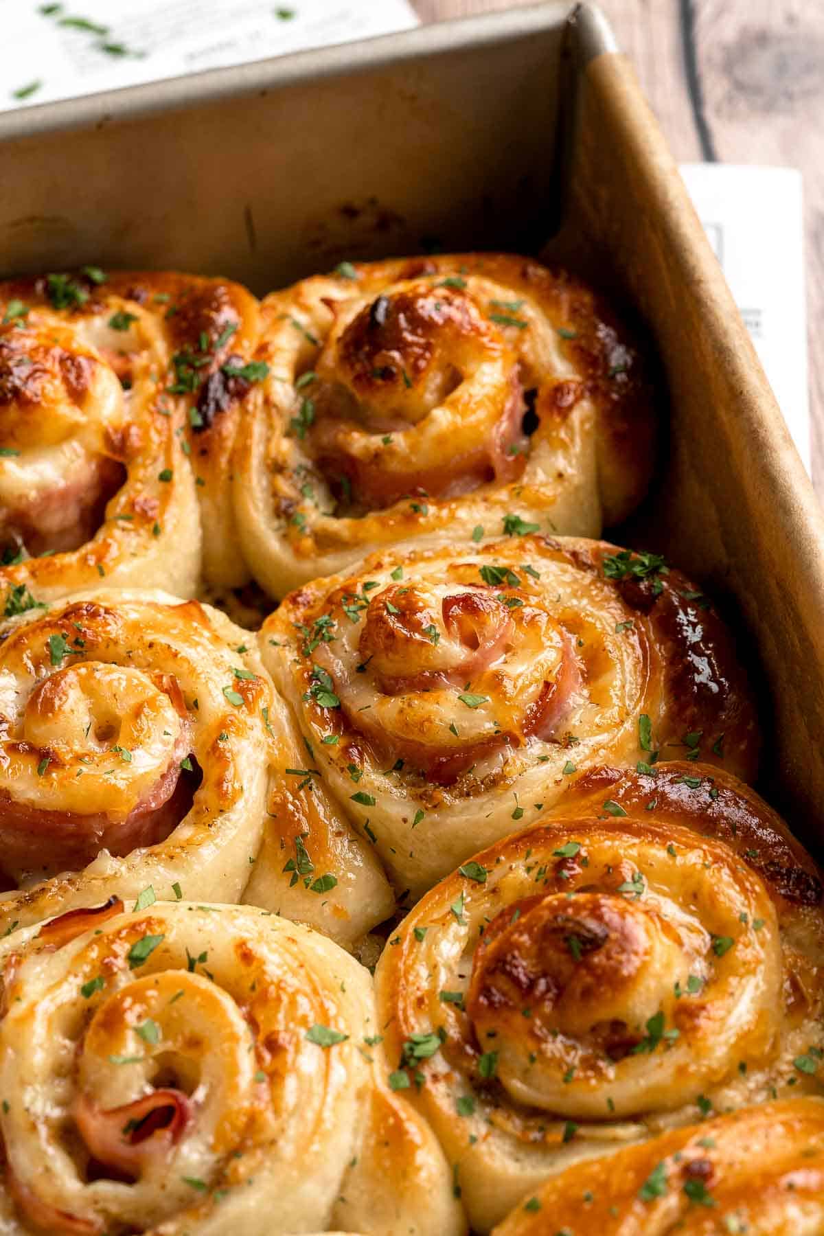 Freshly baked from the oven, these Ham and Cheese Pinwheels are warm and tender with gooey melty cheese and sweet ham. Perfect for lunch or dinner! | aheadofthyme.com