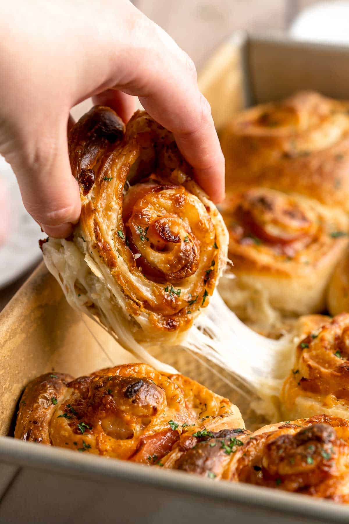 Freshly baked from the oven, these Ham and Cheese Pinwheels are warm and tender with gooey melty cheese and sweet ham. Perfect for lunch or dinner! | aheadofthyme.com