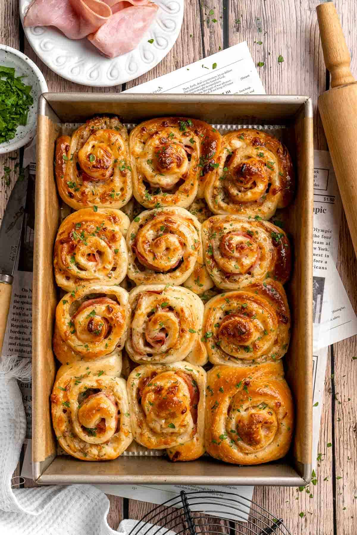 Freshly baked from the oven, these Ham and Cheese Pinwheels are warm and tender with gooey melty cheese and sweet ham. Perfect for lunch or dinner! | aheadofthyme.com