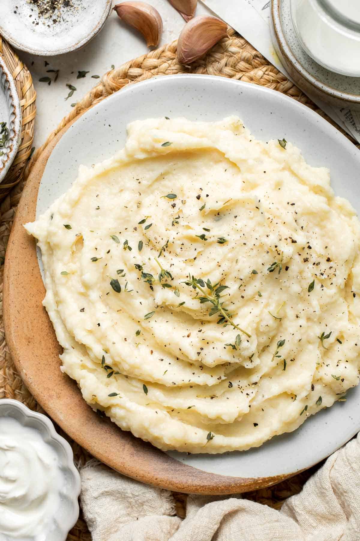 This fluffy, creamy Parsnip Puree looks like mashed potatoes but has a distinctly nutty flavor that sets it apart. It is quick and easy to make too! | aheadofthyme.com