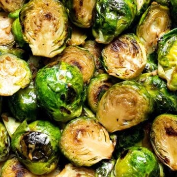 Balsamic Brussels Sprouts are garlicky, salty, and sweet. They are sautéed and coated with a glossy, tangy balsamic glaze and ready in just 15 minutes! | aheadofthyme.com