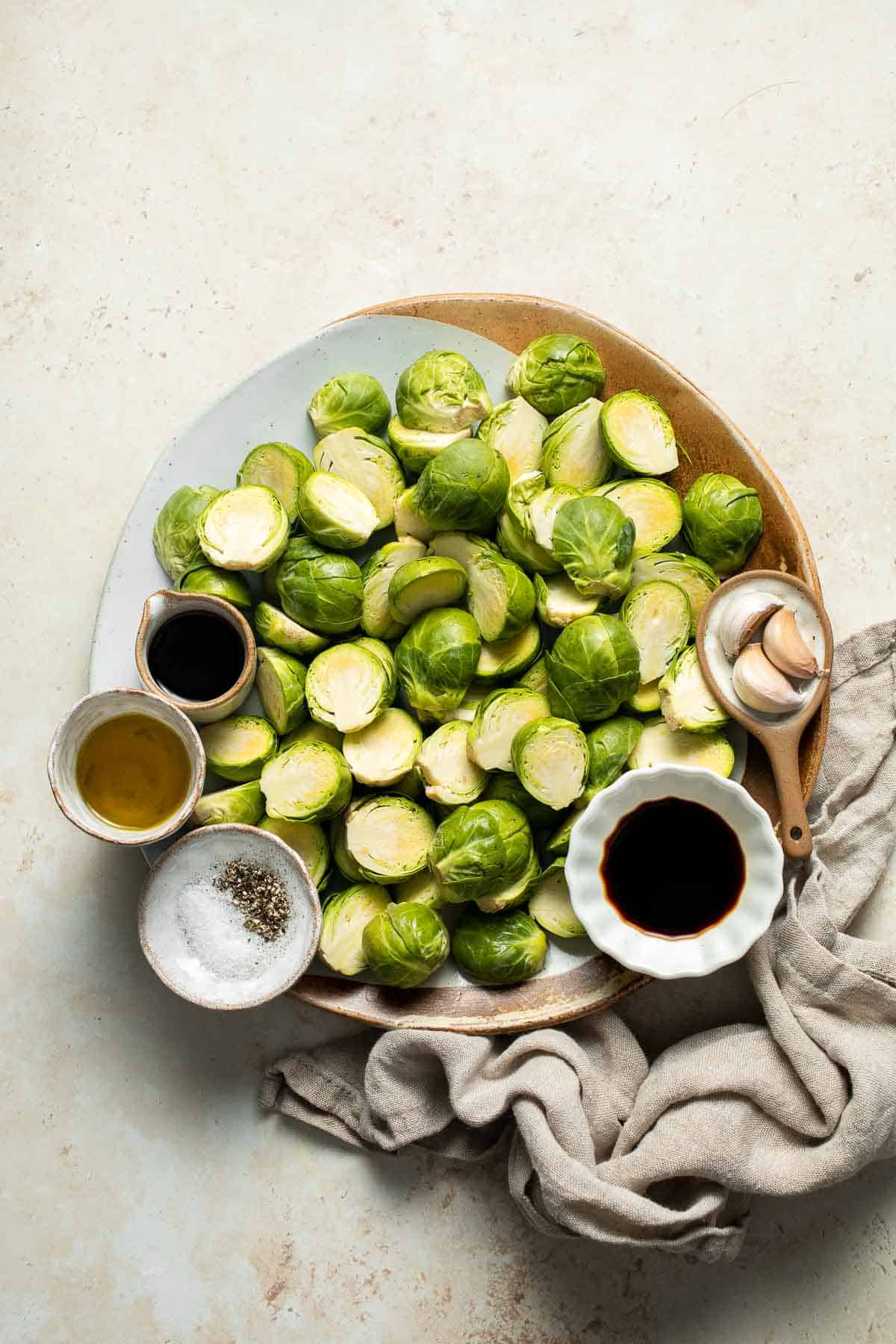 Balsamic Brussels Sprouts are garlicky, salty, and sweet. They are sautéed and coated with a glossy, tangy balsamic glaze and ready in just 15 minutes! | aheadofthyme.com