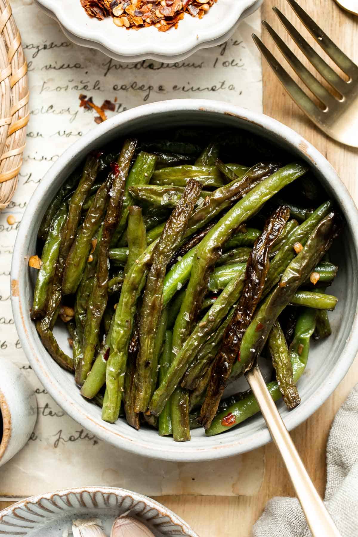Blistered Green Beans are smoky, garlicky, and peppery. This flavorful side dish is one of the quickest ways to prepare fresh green beans. | aheadofthyme.com