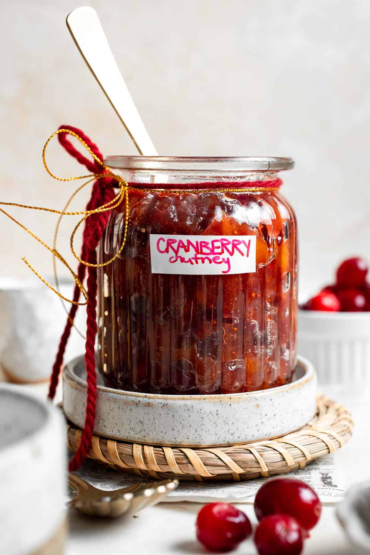 Sweet and savory Cranberry Chutney is a tangy condiment made from tart cranberries, sweet dried apricots, and savory aromatics. Ready in 30 minutes! | aheadofthyme.com
