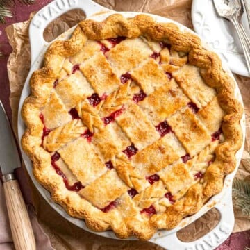 This Cranberry Pie features an orange-infused cranberry pie filling steeped with warm, aromatic spices, all nestled under a gorgeous lattice pie crust. | aheadofthyme.com